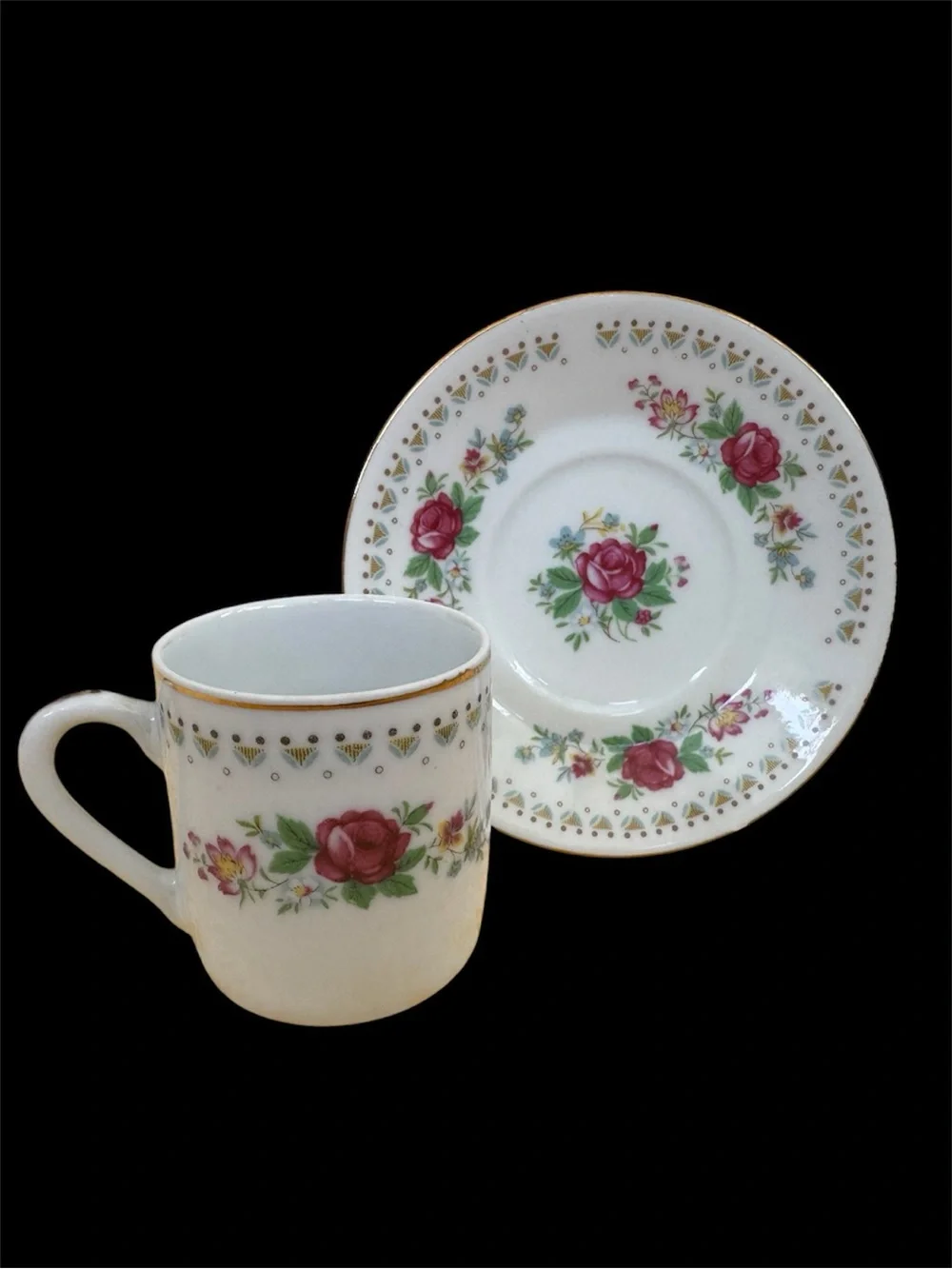 Vintage Espresso Cup and Matching Saucer. White Porcelain with Floral Motif.